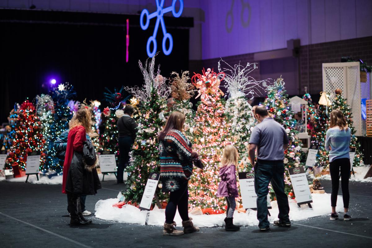 People viewing  trees at Festival of Trees in Rochester, MN